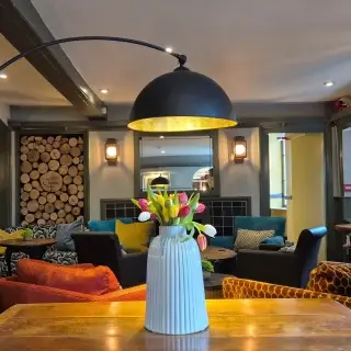 We had the pleasure of handing over the refurbishment of The Crown Hotel, Lynton just before the Easter Weekend last week. Our first tenanted pub for St Austell Brewery working with their business partner Roger Payne of Eclection Group and main contractors Stenball Group.

The 17th Century former Coaching Inn has been fully refurbished inside and out, comprising of an intimate Devonshire pub, showcasing hand-painted murals by the late Mick Cawston, a cosy hotel lobby lounge, a 40 cover restaurant and 12no. boutique bedrooms with new en-suites. 

An exterior colour change in heritage colours has helped redefine the individual volumes of the hotel enabling the iconic Lynton pub to regain its identity within the streetscape once more further enhanced by an overhaul of the signage by SR Signs.

The ground floor public areas have been reinvigorated with bold textures and rich colours to create a quirky and eclectic aesthetic, while remaining sympathetic to the history of the building. Key pieces of antique furniture and feature lighting have helped to improve the sense of arrival and the customer journey between the spaces. The bedrooms and en-suites have a vintage but contemporary feel, elevating the experiential quality of a luxury stay at the hotel. 

We are itching to get back to complete phase 02 of the refurbishment which will see the formation of a further three new guest bedrooms. Watch this space!

#hoteldesign #interiordesign #pubdesign #restauratndesign #design #hospitalitydesign #lynton #devon #exmoor #brewery
